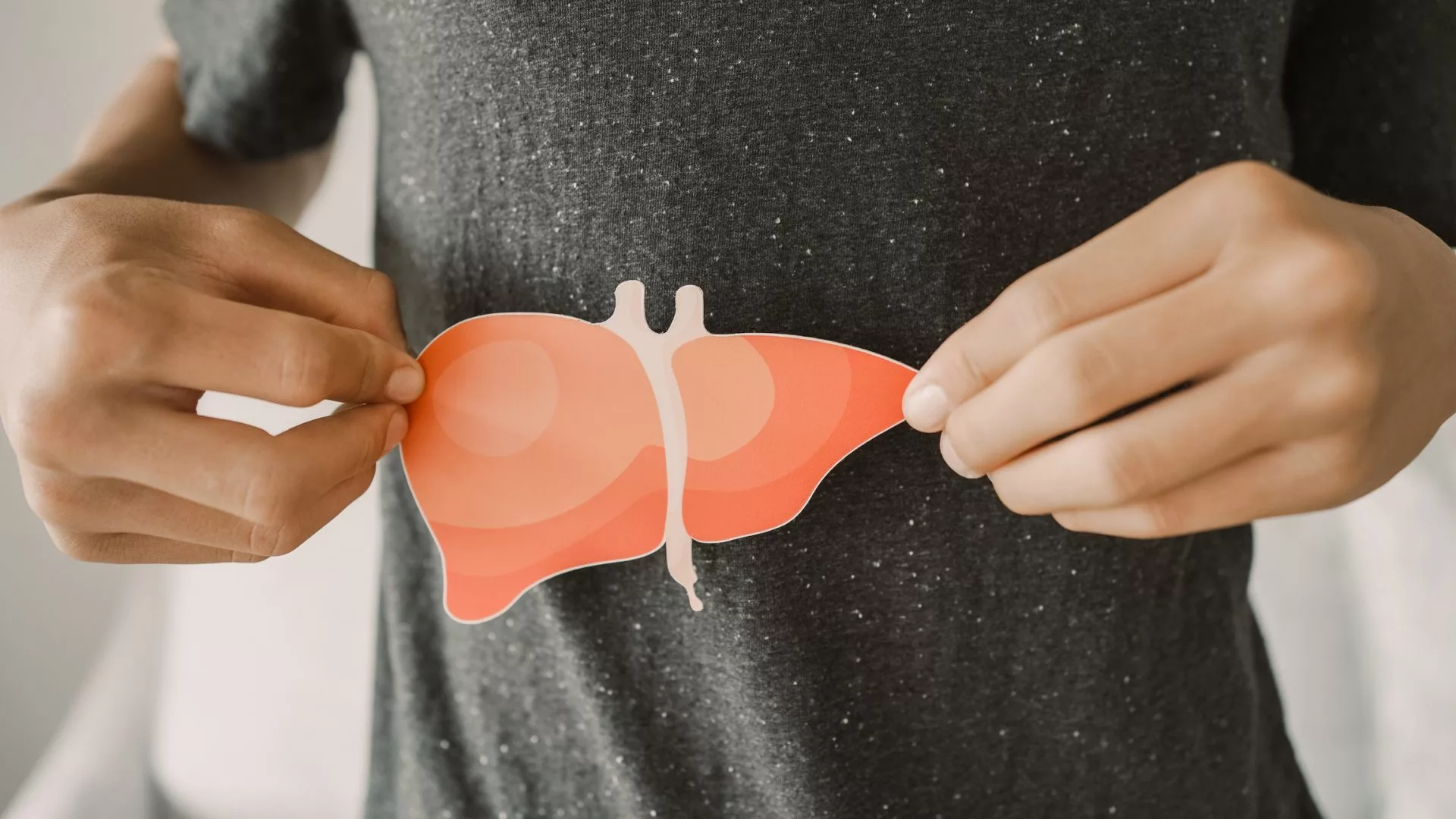 Man holding liver, hepatitis vaccination, liver cancer treatment, world hepatitis day