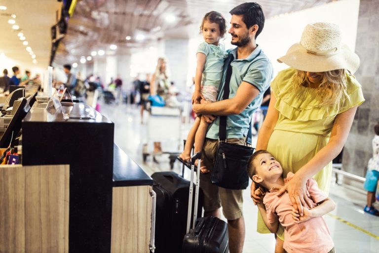 Family checking in at counter for family travel