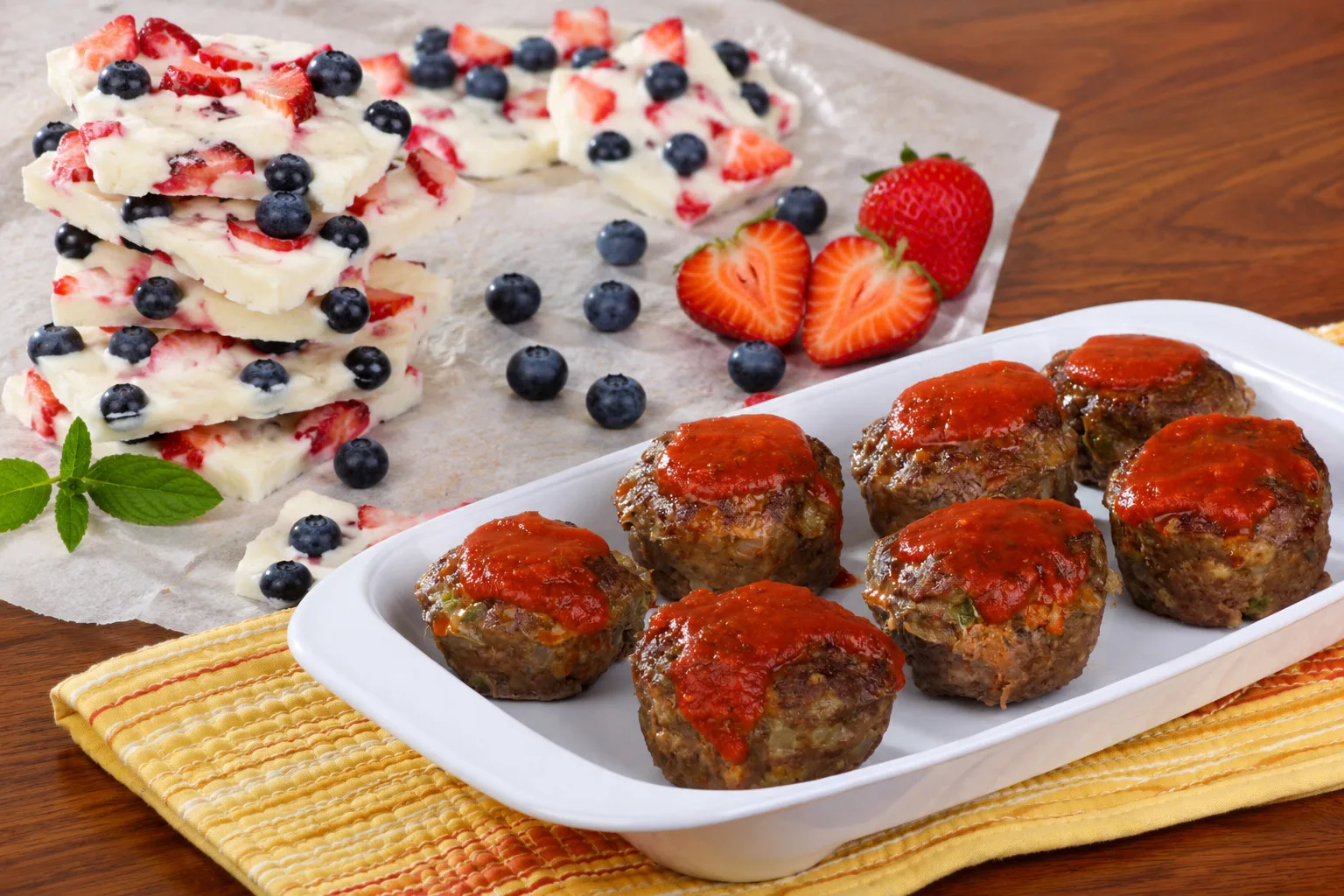Picture of yogurt bark and meatball muffins on a plat on the table